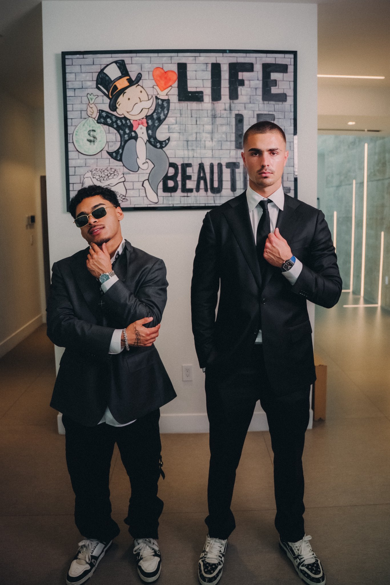 TJR in suits in front of Life is Beautiful art